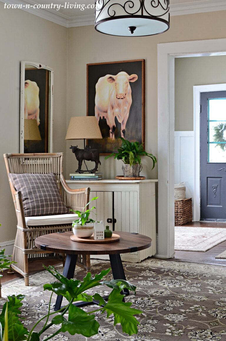 Country Style Sitting Room with Large Cow Painting