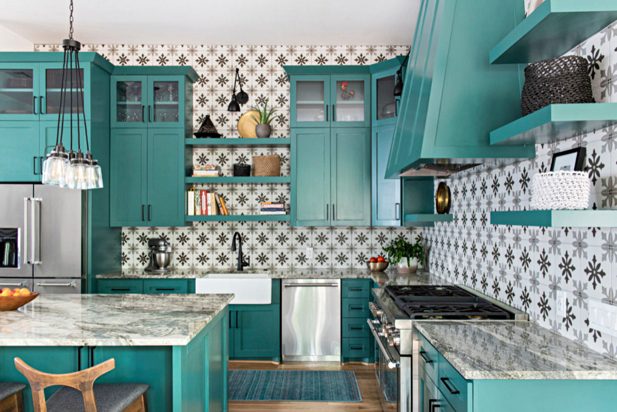 kitchen with teal cabinet and striped wall