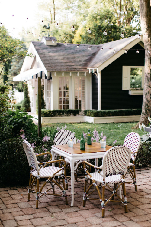 Patio with White Furniture at Dark Gray Cottage