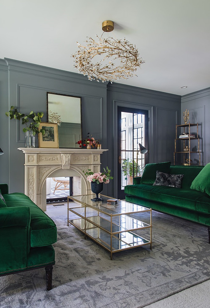 gray living room with green sofas