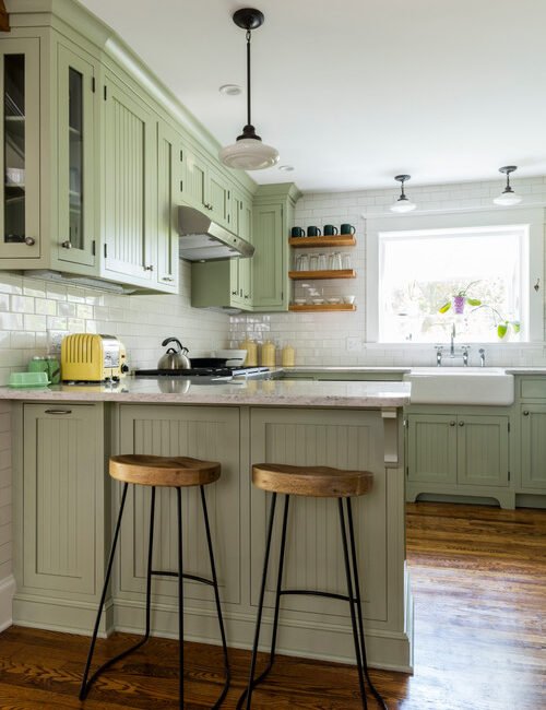 Light Green Cabinets in Classic Kitchen with Wood Floors