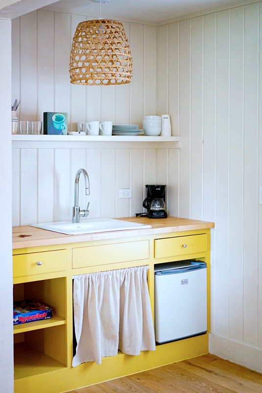 Yellow cabinets in a small kitchen