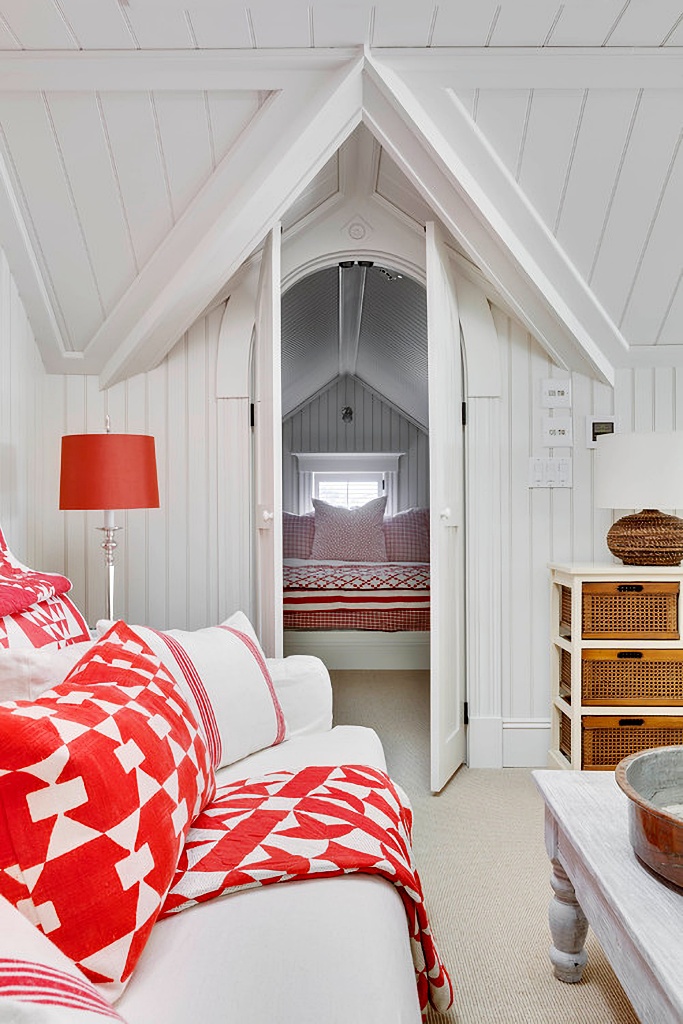 red and white sitting room leading to bedroom