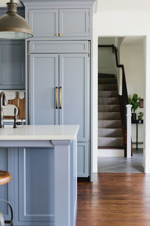 Farmhouse kitchen with blue recessed panel cabinets