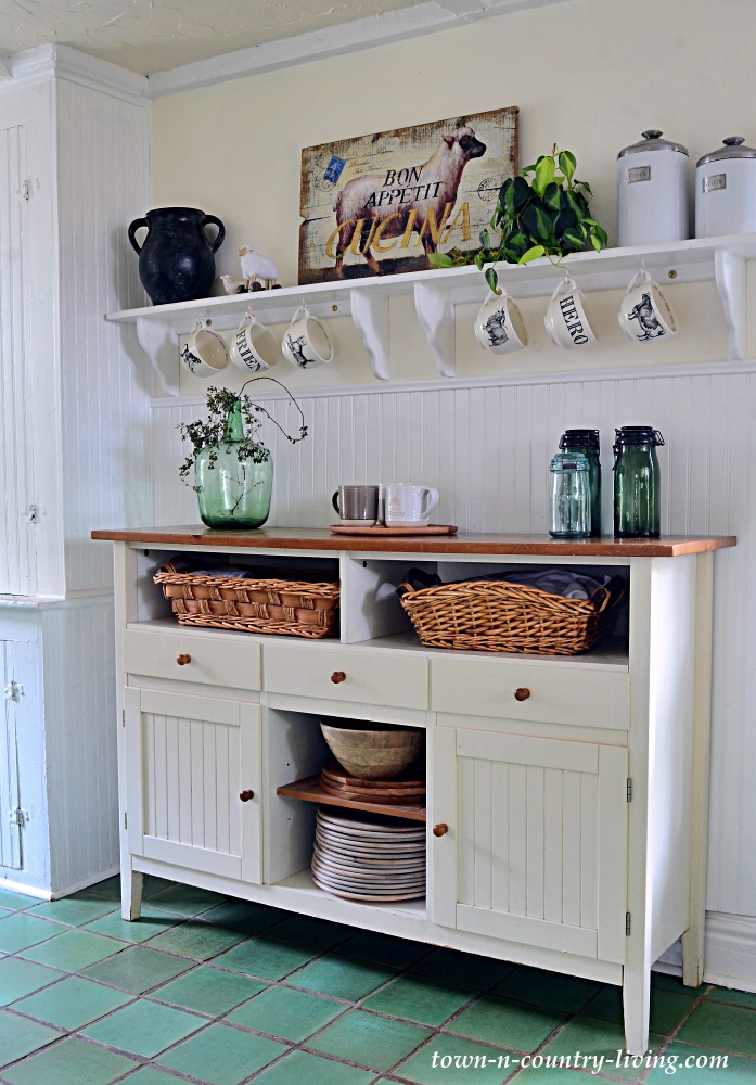 kitchen hutch with vintage green French canning jars