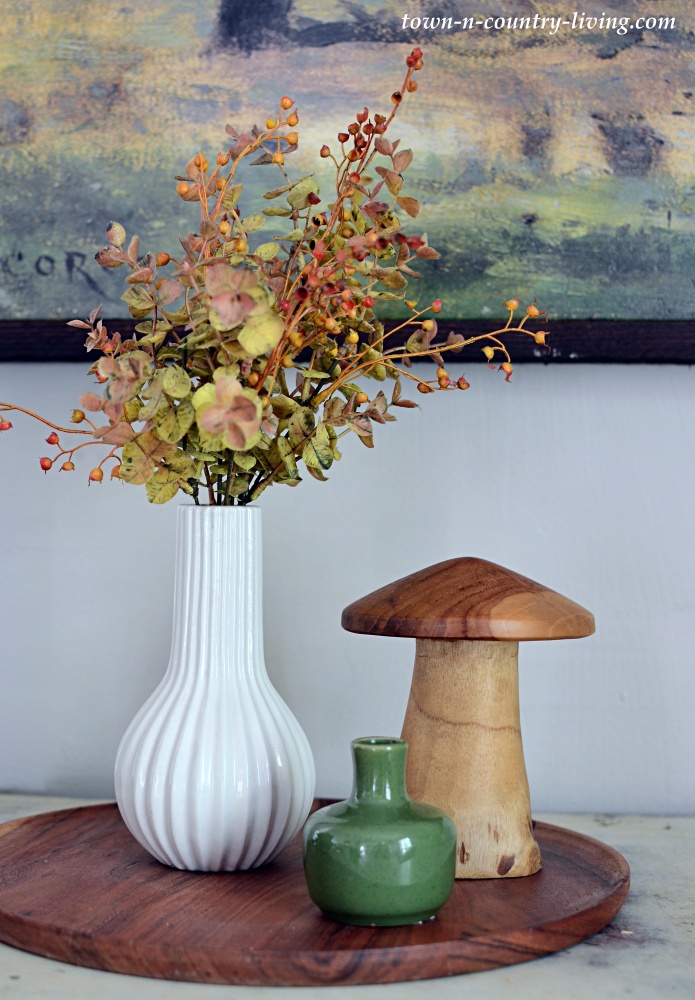 fall vignette with vases, floral pick, and wooden mushroom