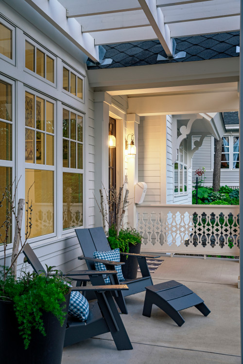 Scandinavian style front porch with blue-gray Adirondack chairs