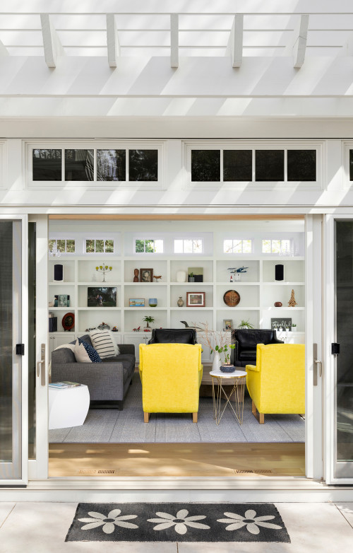 Navy and yellow family room with bookcase wall