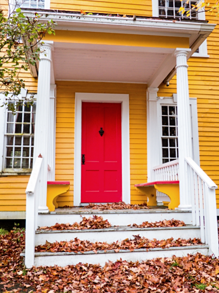 Yellow House with Red Door During Autumn