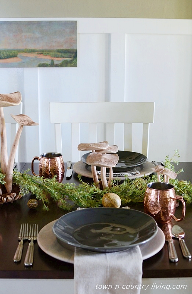 earthy table setting with wooden mushrooms