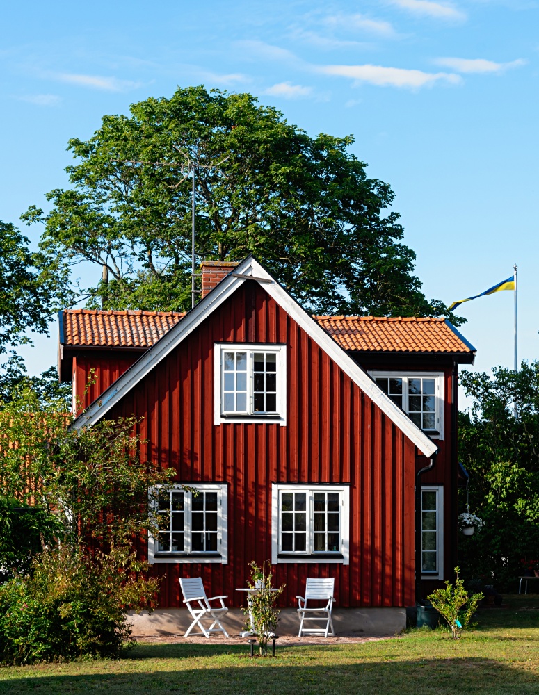 Traditional red wooden house in Sweden on the island Oland