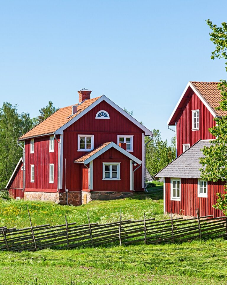 Red farm house in rural environment