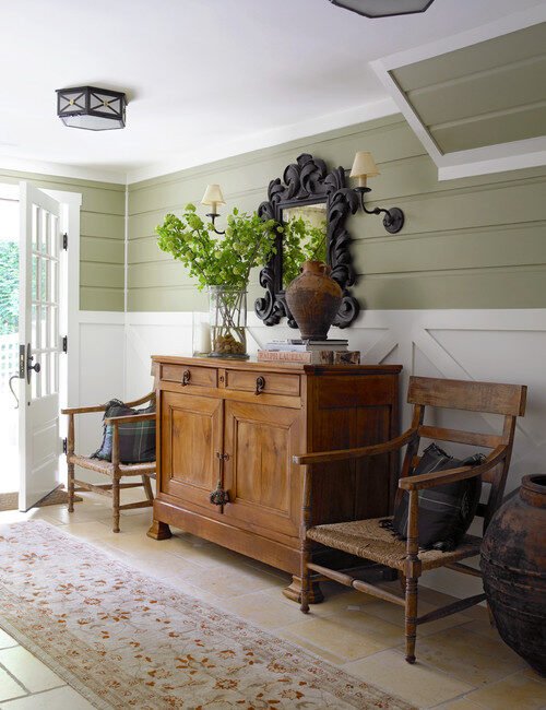 country style entryway with vintage wood cabinet