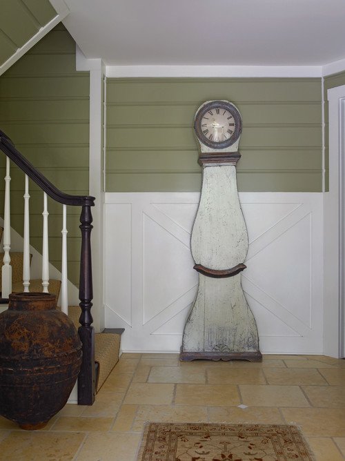 Country style entryway with staircase and moira clock