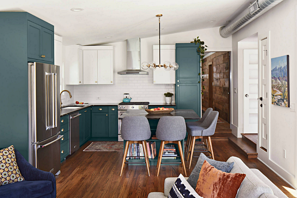Bungalow style kitchen with blue-green and white cabinets
