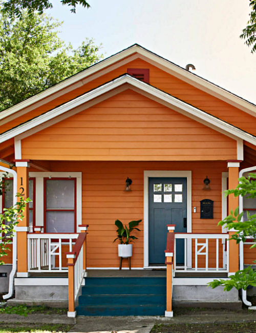 Orange Bungalow Home with Dark Blue Front Door