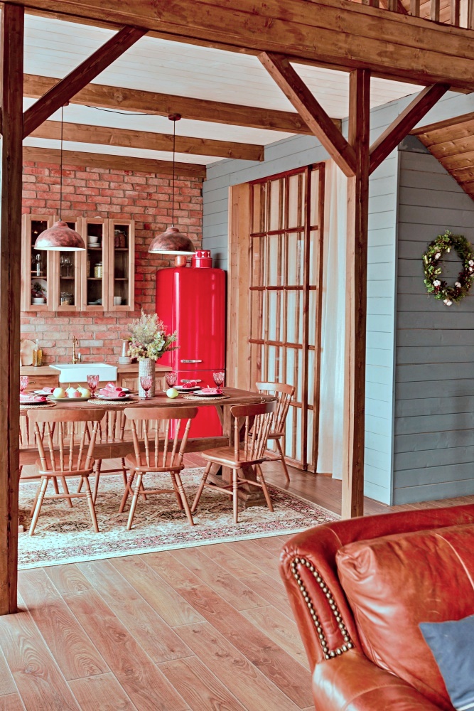 ski chalet kitchen with brick wall and red SMEG refrigerator
