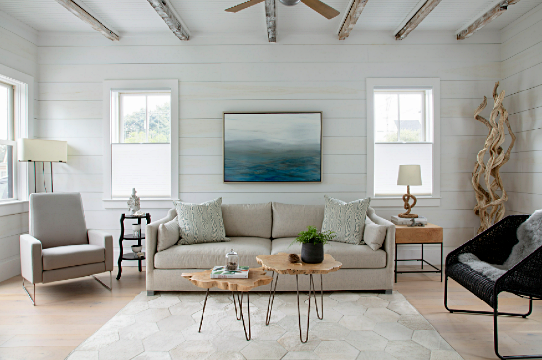 Beach style Cape Cod living room with ocean painting and driftwood art