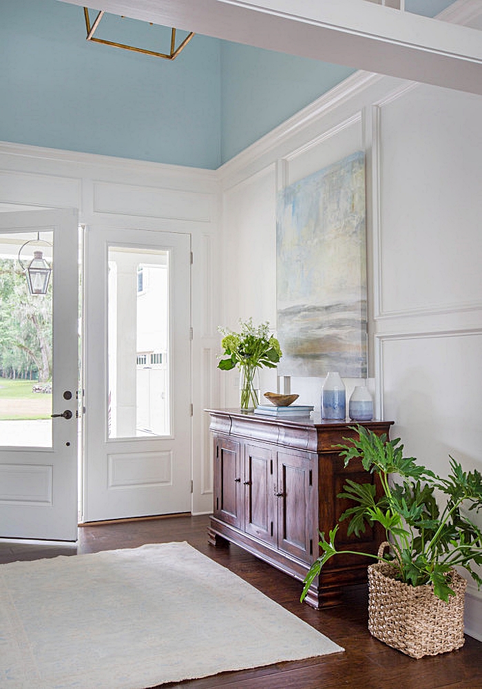 Home entryway with light blue ceiling