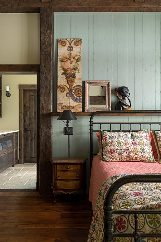 Vintage iron bed with antique quilts
