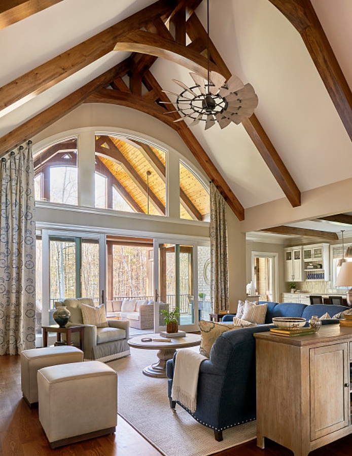 Traditional living room with neutral color scheme and vaulted beamed ceiling
