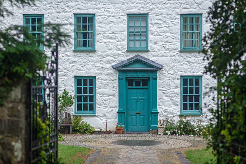 Creamy English cottage with blue trim in Wales