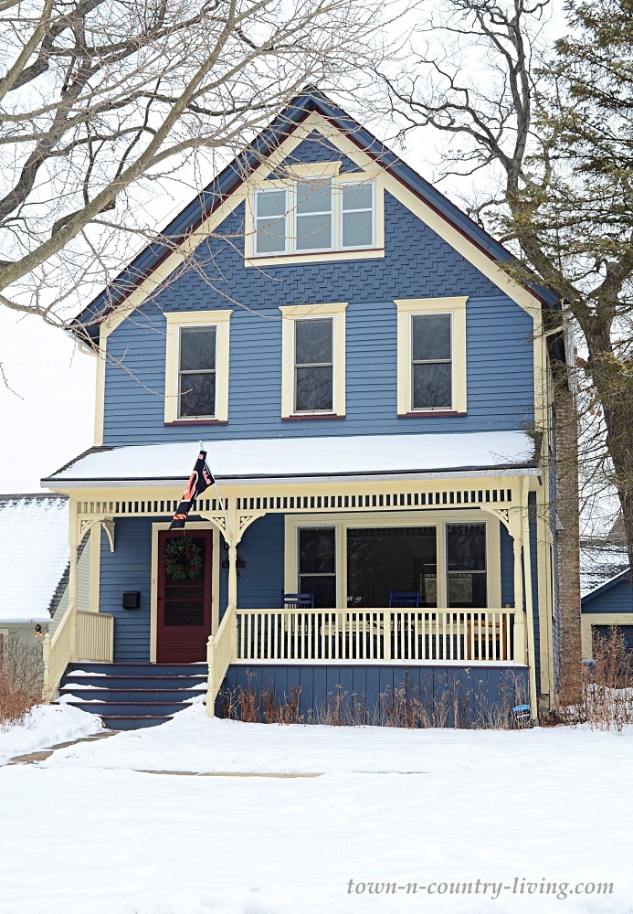 Blue Victorian house on a snowy day