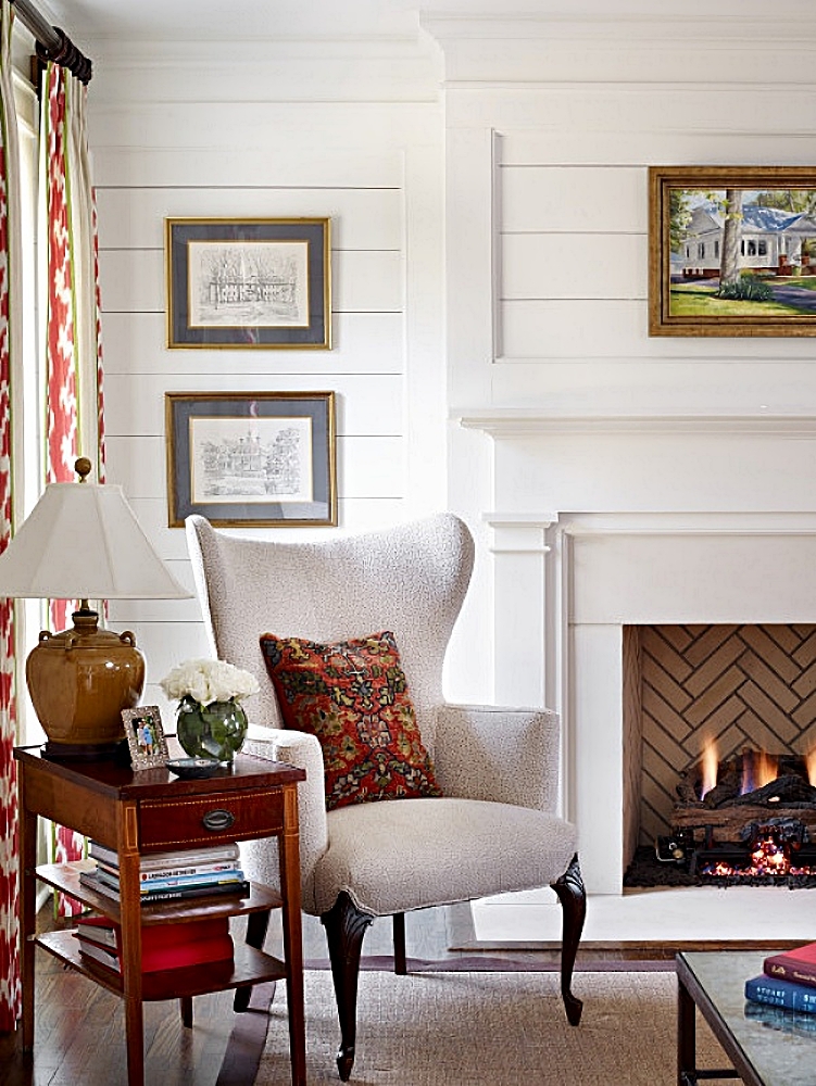 traditional living room with fireplace and wing chair