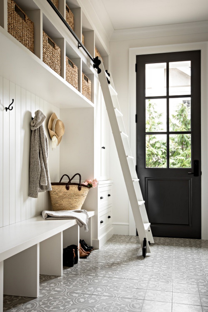 Farmhouse style mudroom with library ladder