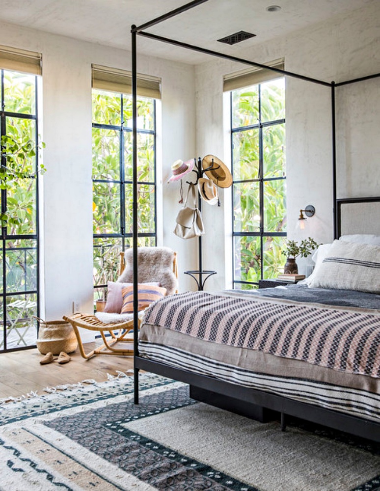 Industrial style bedroom with 4-poster canape bed