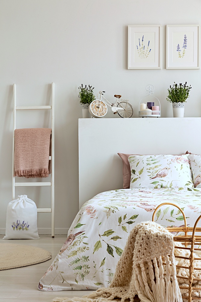 spring feminine bedroom with potted lavender