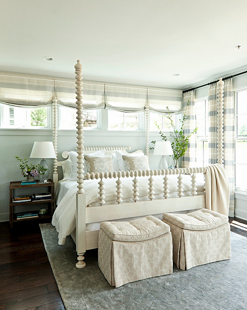 white Jenny Lind bed in pale blue bedroom