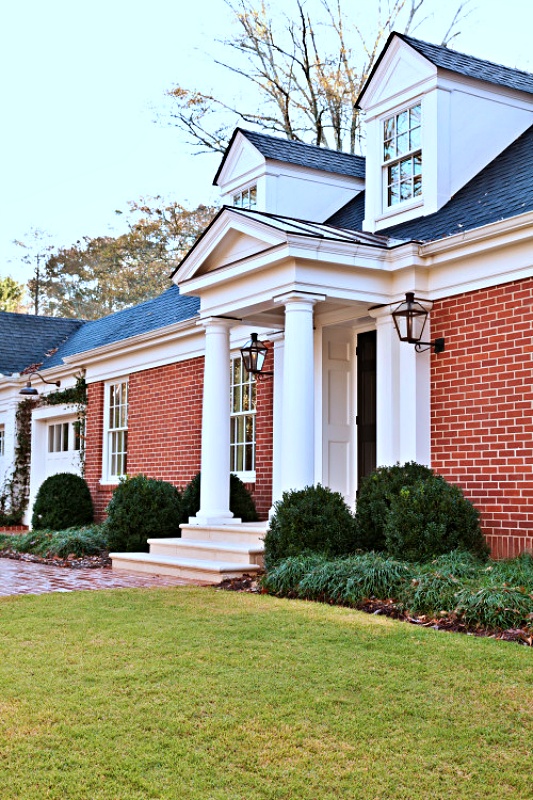 Classic Home Remodel - Brick exterior with white pillars