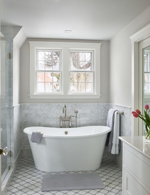 Pale gray spa bathroom with free standing tub
