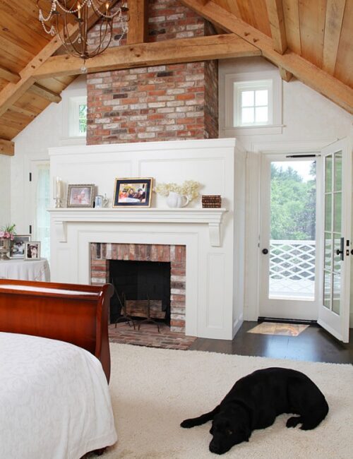 Historic farmhouse bedroom with fireplace