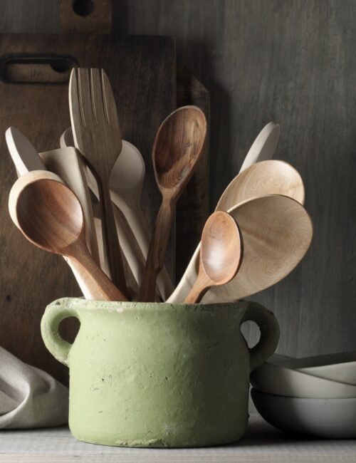 wooden spoons in a vintage stone crock