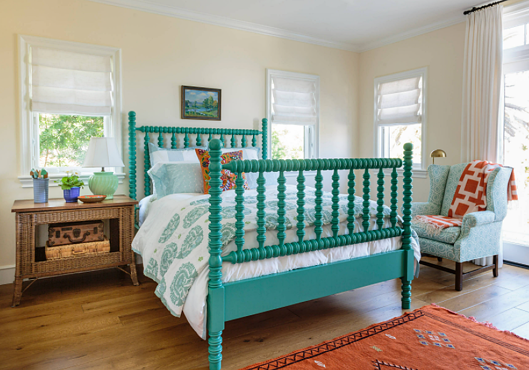 colorful bedroom with bright aqua jenny lind bed