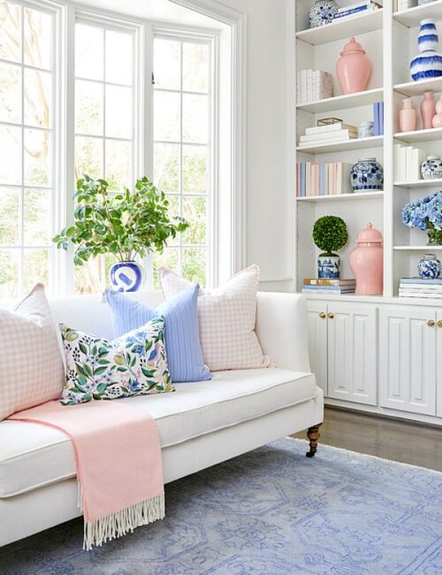 elegant pastel living room in pink, blue, and white