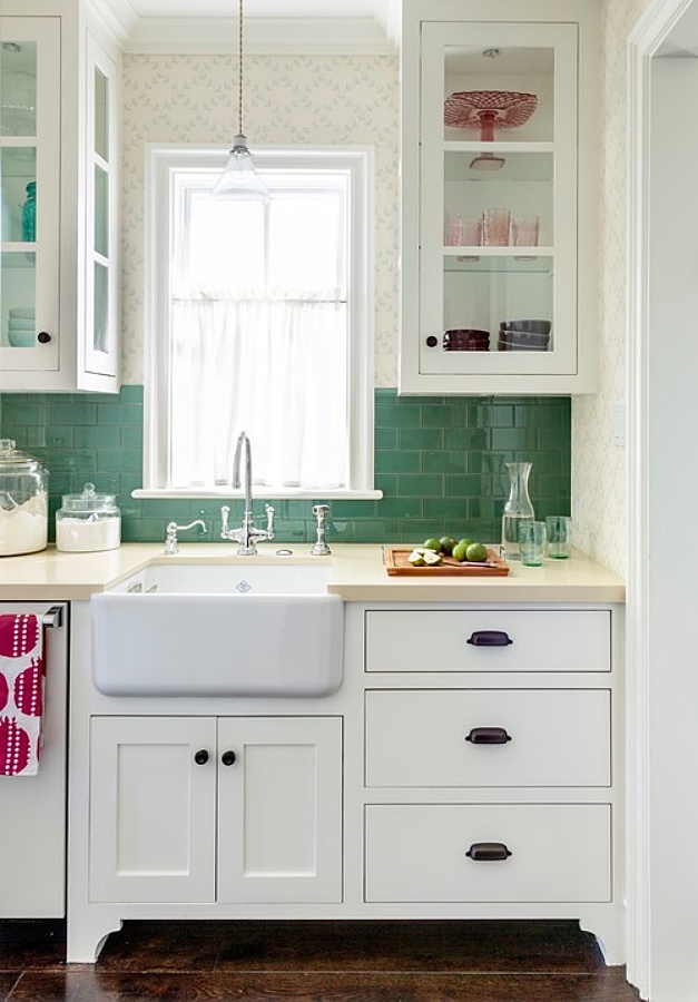 white cottage kitchen with green subway tile