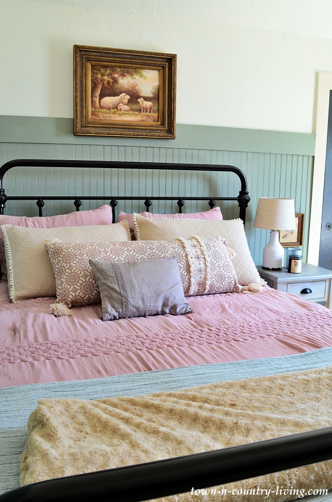 Modern country bedroom in green, pink, and blue