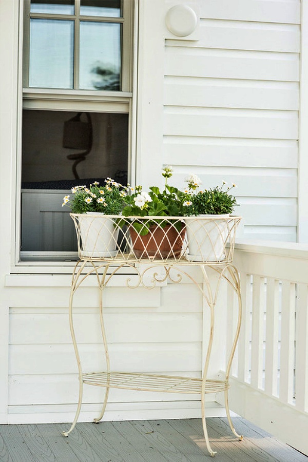 White shabby chic front porch with flowers