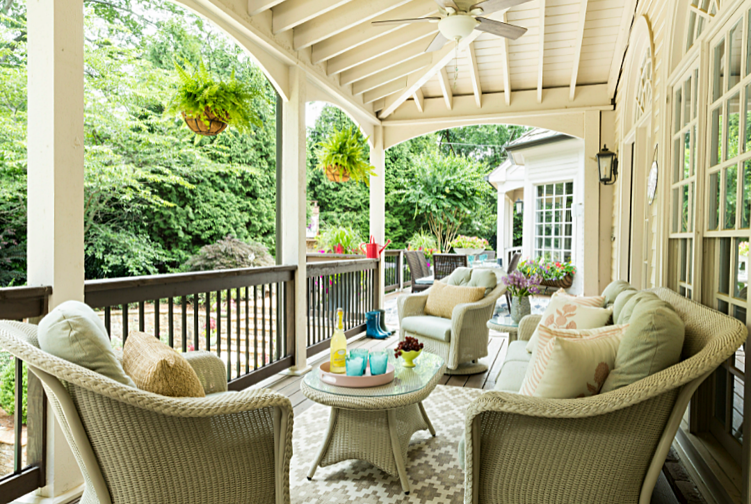 Big southern porch in the summer with wicker furniture 