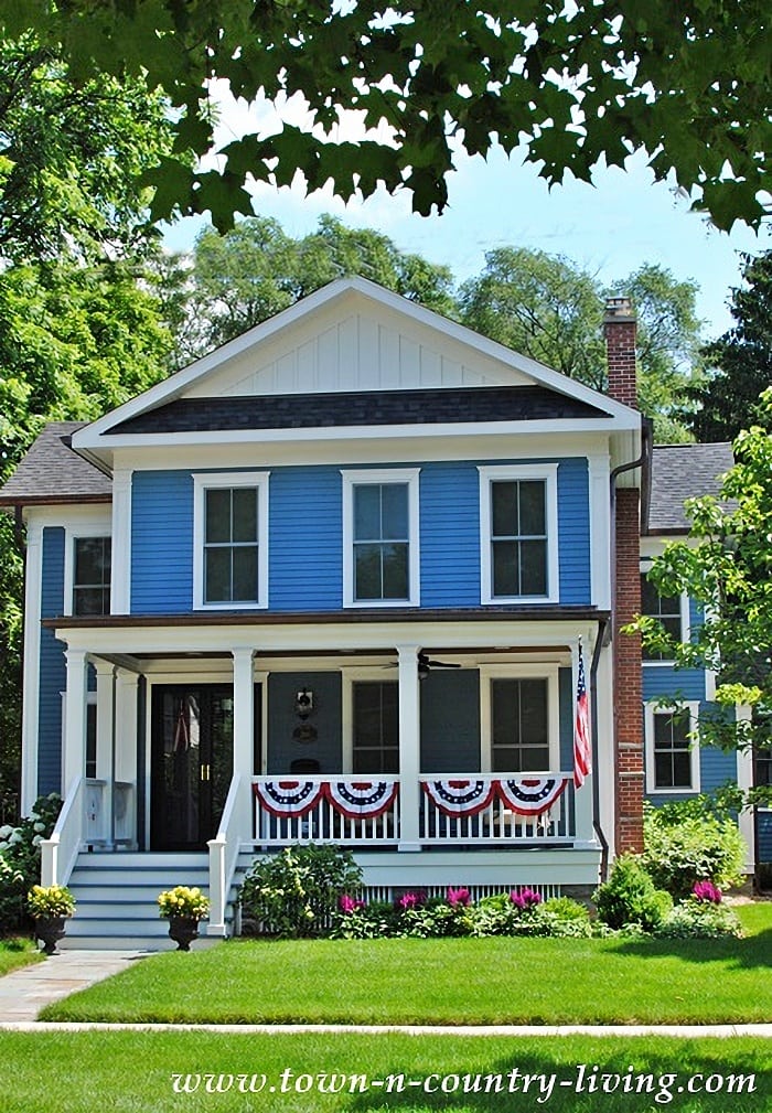 Blue farmhouse with full porch in Wheaton, IL