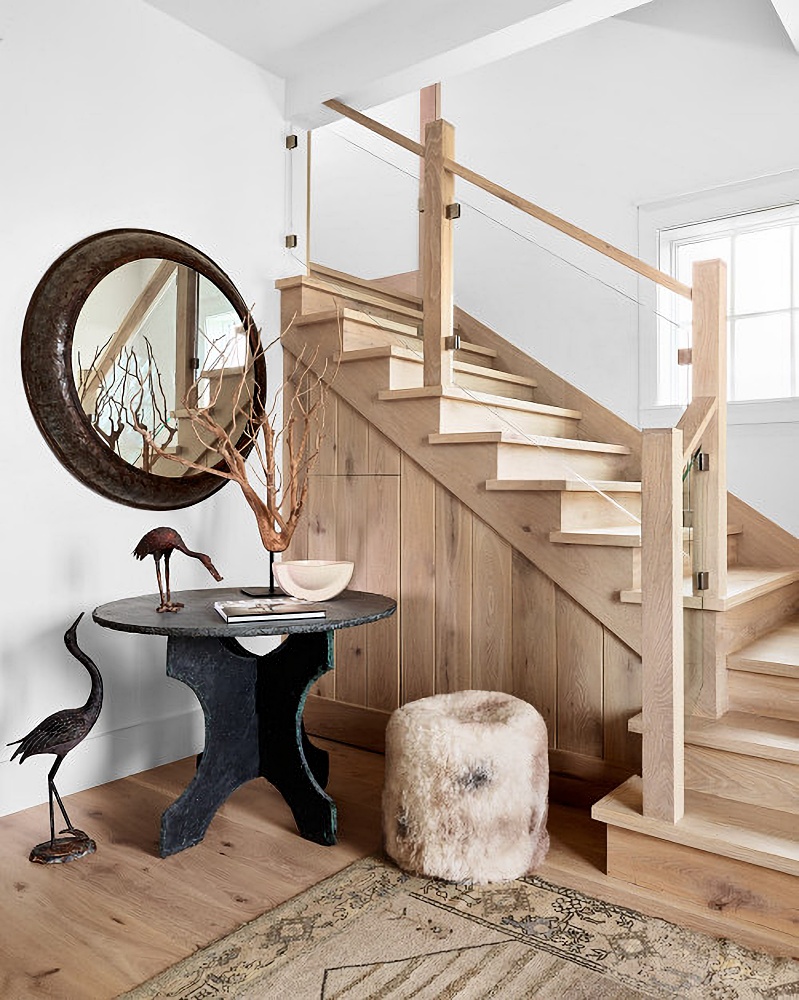 Modern country entryway with wood staircase