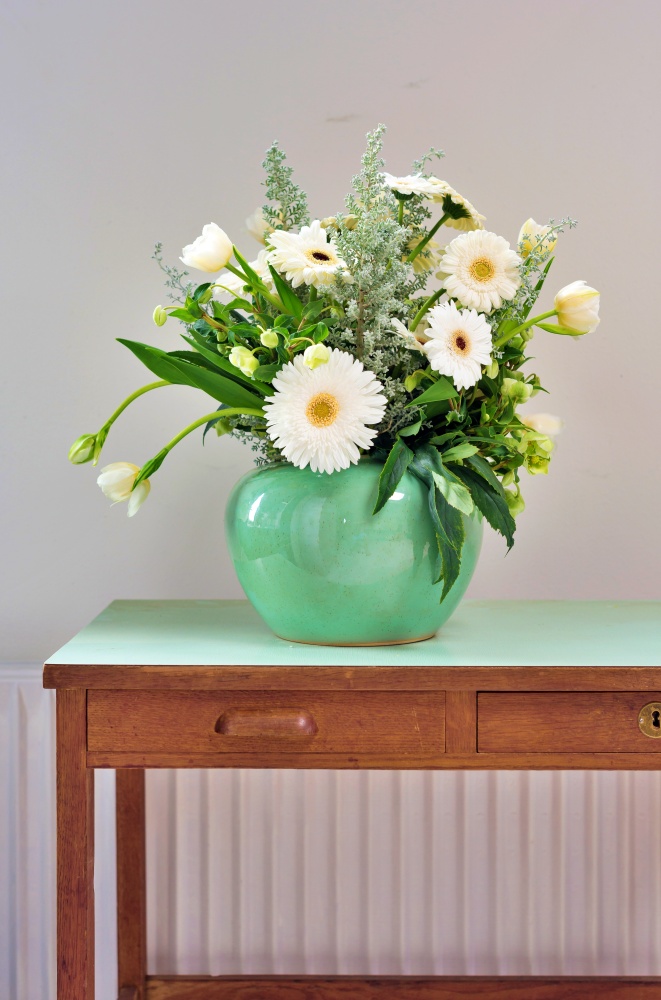 Spring bouquet of Gerbera daisies in green vase