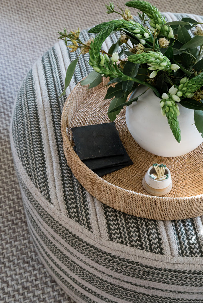 family room ottoman and vignette