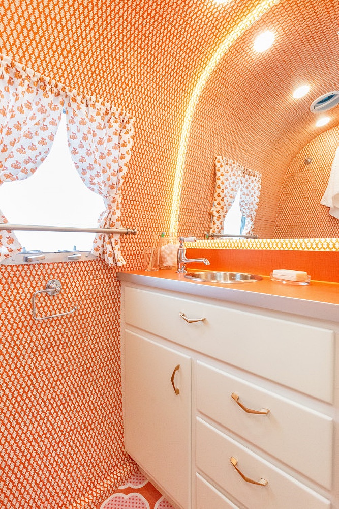 orange bathroom in an Airstream vacation camper