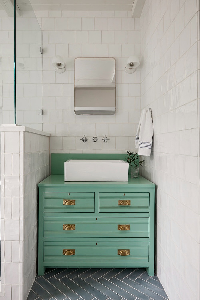 Vintage seafoam green vanity in beach style bathroom