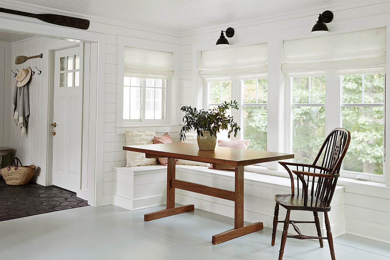 Farmhouse style dining room with wall of windows