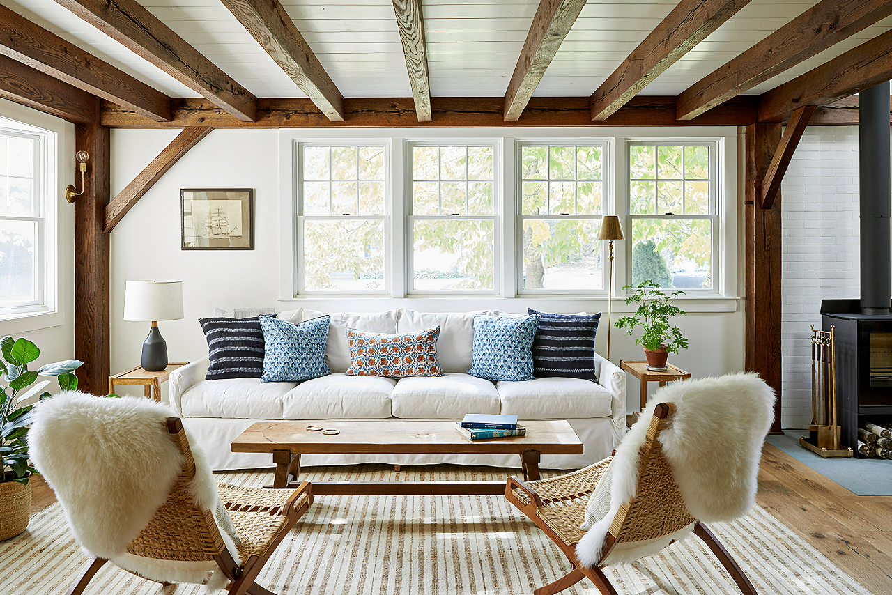 Timber frame living room with slipcovered sofa